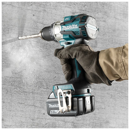 Makita DHP489Z hammer drill-driver drilling into masonry
