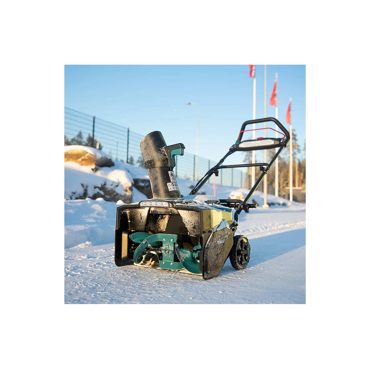 Makita SN001G 40V MAX XGT snow blower standing in snow