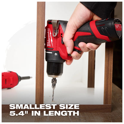 A hand grips a red and black Milwaukee cordless drill with a drill bit attached. "Smallest size 5.4" in length" is written at the bottom. Another red drill lies in the background.