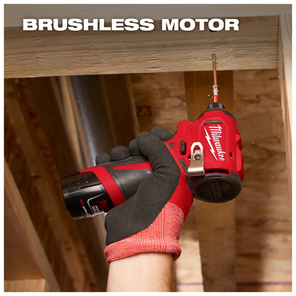 A gloved hand holds a Milwaukee brushless motor drill, screwing a fastener into a wooden beam within a construction area.
