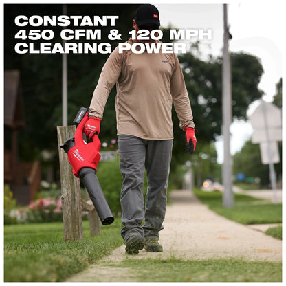 A person uses the Milwaukee M18 Brushless Blower to clear a sidewalk. The blower delivers 450 CFM and 120 MPH clearing power.