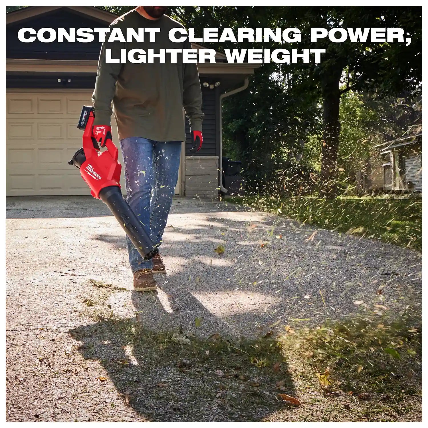 A person uses the Milwaukee M18 Brushless Blower to clear debris on a driveway in front of a garage. The text reads "Constant Clearing Power, Lighter Weight" above it.