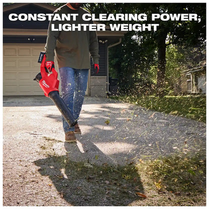 A person uses the Milwaukee M18 Brushless Blower to clear debris on a driveway in front of a garage. The text reads "Constant Clearing Power, Lighter Weight" above it.