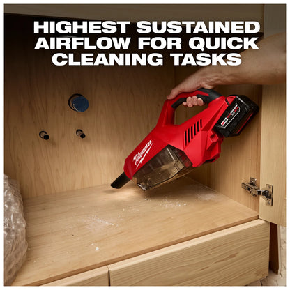 Person using the M18 Brushless Handheld Vacuum to clean wood dust inside a cabinet, with text "Highest Sustained Airflow for Quick Cleaning Tasks."