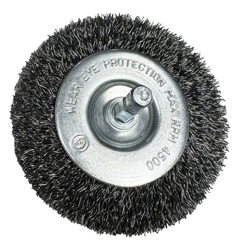 A circular wire wheel brush attachment with a silver metal center hub and black bristles, shown on a plain white background. The metal hub has safety text and a threaded bolt center.